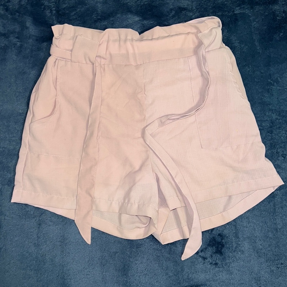 Pink shorts.
